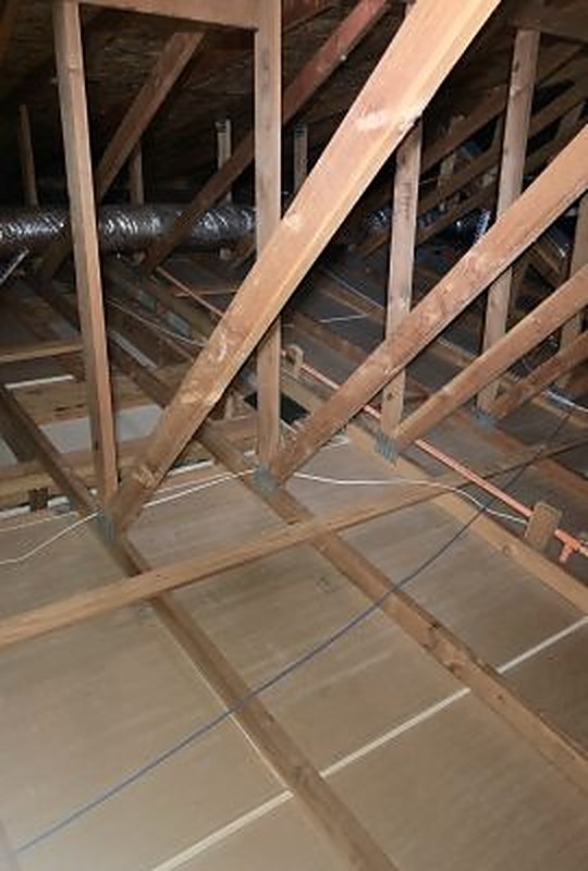 Insulation installed around the truss webs